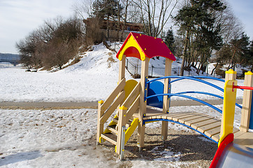 Image showing children play house with red roof wooden ladder  