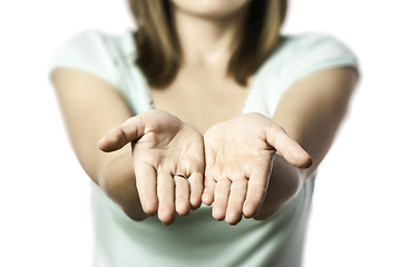 Image showing woman stretches out her empty hands