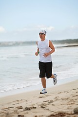 Image showing man is jogging on the beach summertime sport fitness