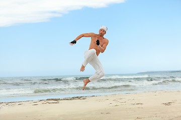 Image showing man is jumping sport karate martial arts fight kick