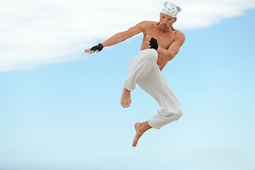 Image showing man is jumping sport karate martial arts fight kick