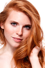 Image showing beautiful young smiling woman with red hair and freckles isolated