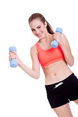 Image showing healthy smiling girl workout with dumbbell isolated 
