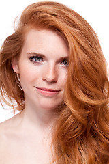 Image showing beautiful young smiling woman with red hair and freckles isolated