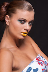 Image showing woman with extreme colorfull make up in blue and yellow