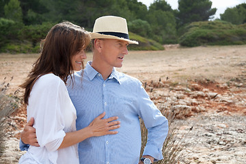 Image showing happy adult couple in summertime on beach 