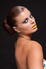 Image showing woman with extreme colorfull make up in blue and yellow