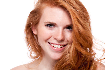 Image showing beautiful young smiling woman with red hair and freckles isolated