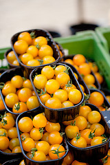 Image showing fresh tasty yellow cherry tomatoes macro closeup on market