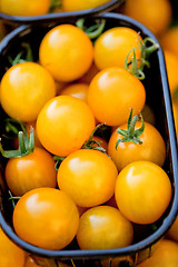 Image showing fresh tasty yellow cherry tomatoes macro closeup on market