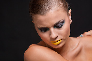 Image showing woman with extreme colorfull make up in blue and yellow