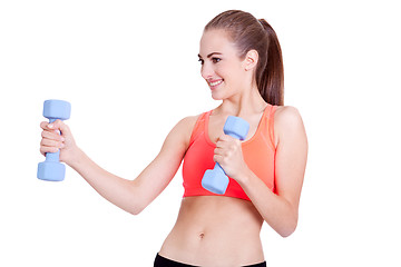 Image showing healthy smiling girl workout with dumbbell isolated 