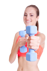 Image showing healthy smiling girl workout with dumbbell isolated 