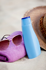 Image showing sunprotection objects on the beach in holiday