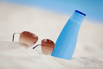 Image showing sunprotection summer holiday sunglasses and cream