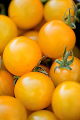 Image showing fresh tasty yellow cherry tomatoes macro closeup on market