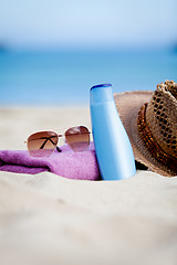 Image showing sunprotection objects on the beach in holiday