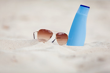 Image showing sunprotection summer holiday sunglasses and cream