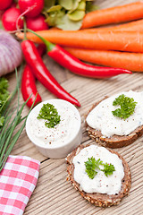 Image showing fresh tasty homemade cream cheese and herbs with bread