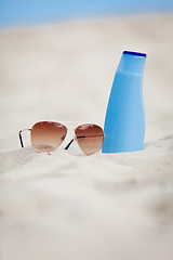 Image showing sunprotection summer holiday sunglasses and cream