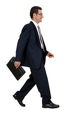 Image showing attractive successful adult business man in black suit isolated