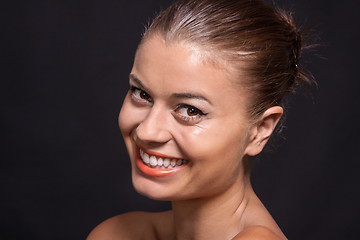 Image showing beautiful young woman with orange lipstick and brown eyes 