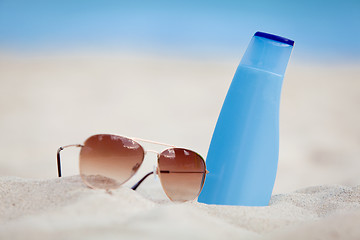 Image showing sunprotection summer holiday sunglasses and cream