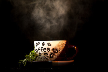 Image showing Steaming hot cup of coffee