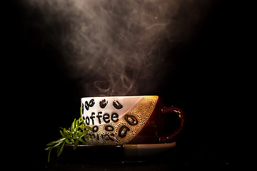 Image showing Steaming hot cup of coffee