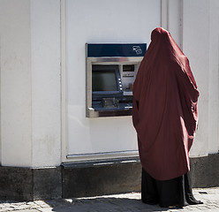 Image showing Muslim lady by cashpoint