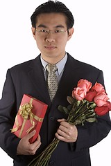 Image showing Asian People With Roses And Present