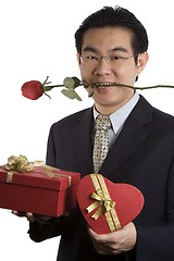 Image showing Holding Rose In Mouth