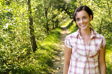 Image showing Young Caucasian girl on a hiking path