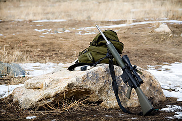 Image showing rifle on rock