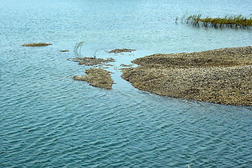 Image showing Pebbles heap in a marine lagoon 