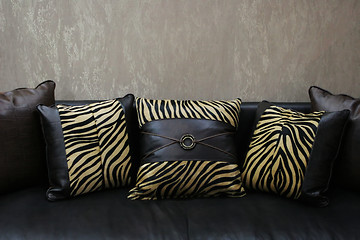 Image showing Modern sofa with leopard skin cushions (copy space) - home inter