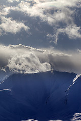 Image showing Mountains in evening and sunlight clouds