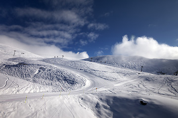 Image showing Ski resort with off-piste and ratrac slope. 