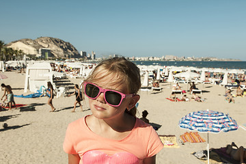 Image showing Girl with shades on a beach