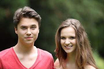 Image showing Smiling young teenage boy and girl