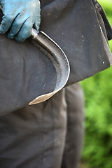 Image showing Curved scraping tool for cleaning a chimney flue