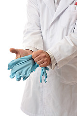 Image showing Doctor or Scientist putting on gloves