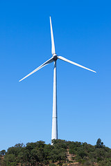 Image showing Wind electric generator against blue sky