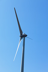 Image showing Wind electric generator against blue sky