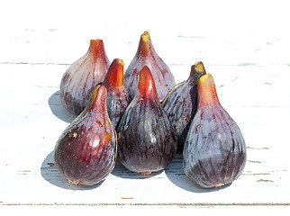 Image showing Fresh fig fruits on white wooden background