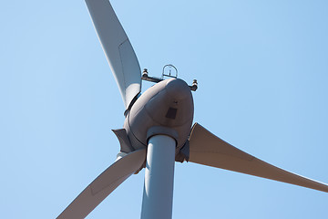 Image showing Wind electric generator against blue sky background