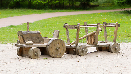 Image showing Wooden toy tractor with trailer