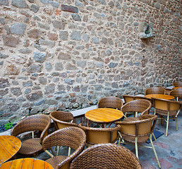 Image showing summer cafe near the ancient stone wall