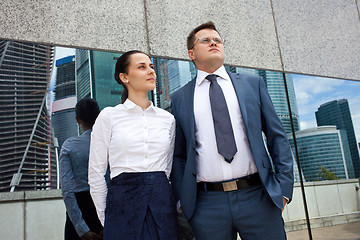 Image showing young businessmen on the background of office buildings