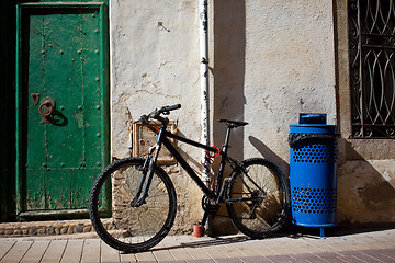 Image showing old bicycle near the ancient walls